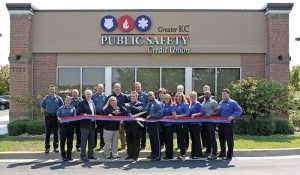 public safety credit union staff in front of new building