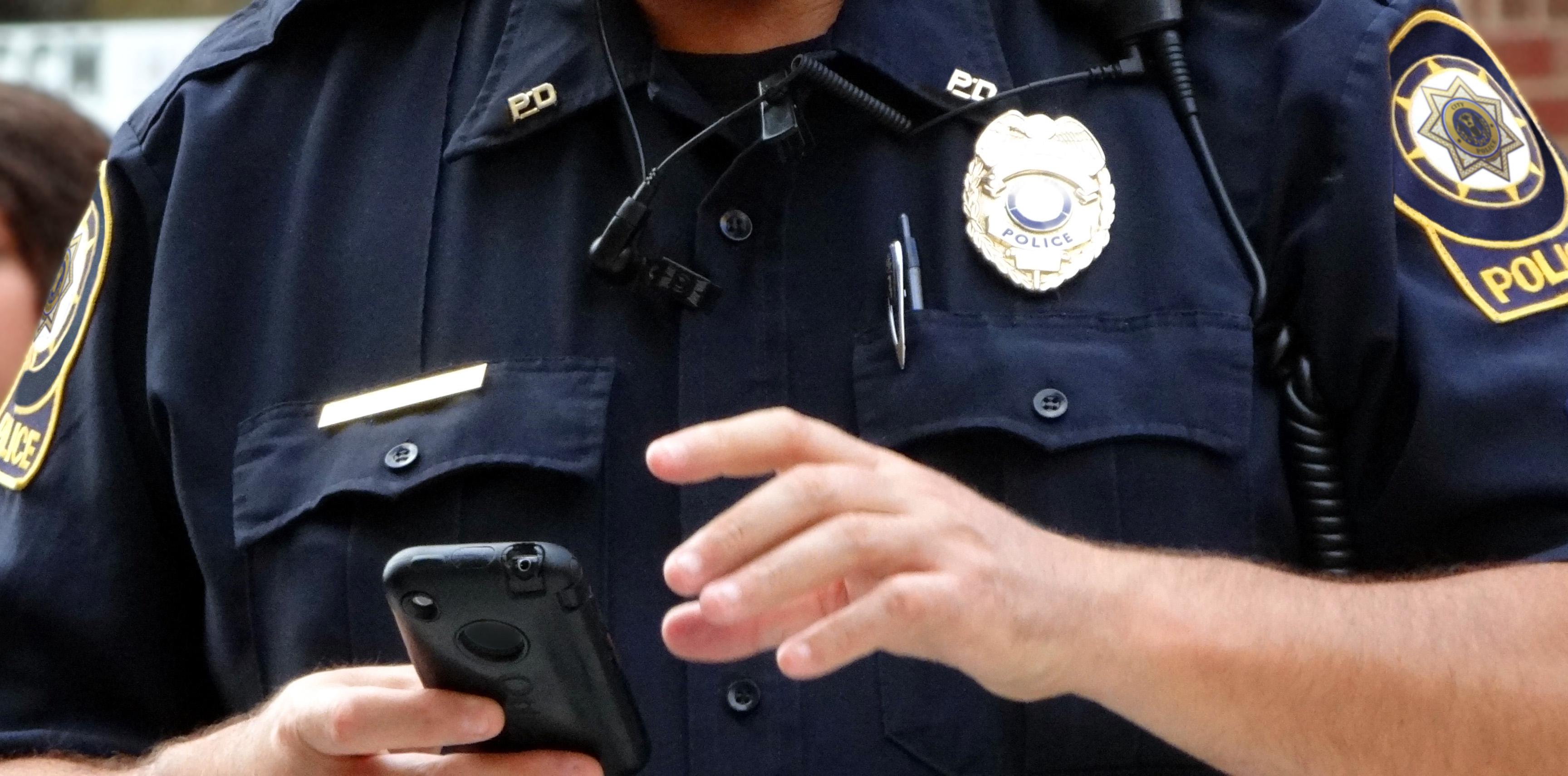 officer using smartphone