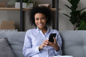 EasyVest Investments Woman Holding Mobile Phone
